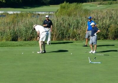 four men golfing