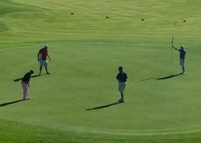 four men on a golf course