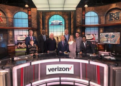 group of people on set of NFL Today
